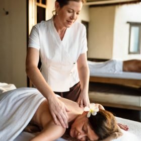 female-message-therapist-giving-a-massage-at-a-spa-W-1.jpg